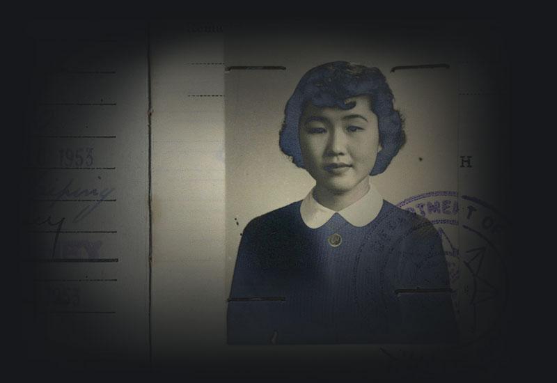 Photo of Mikiko Casey on her registration document stamped Department of immigration, Naturalised, Cancelled.