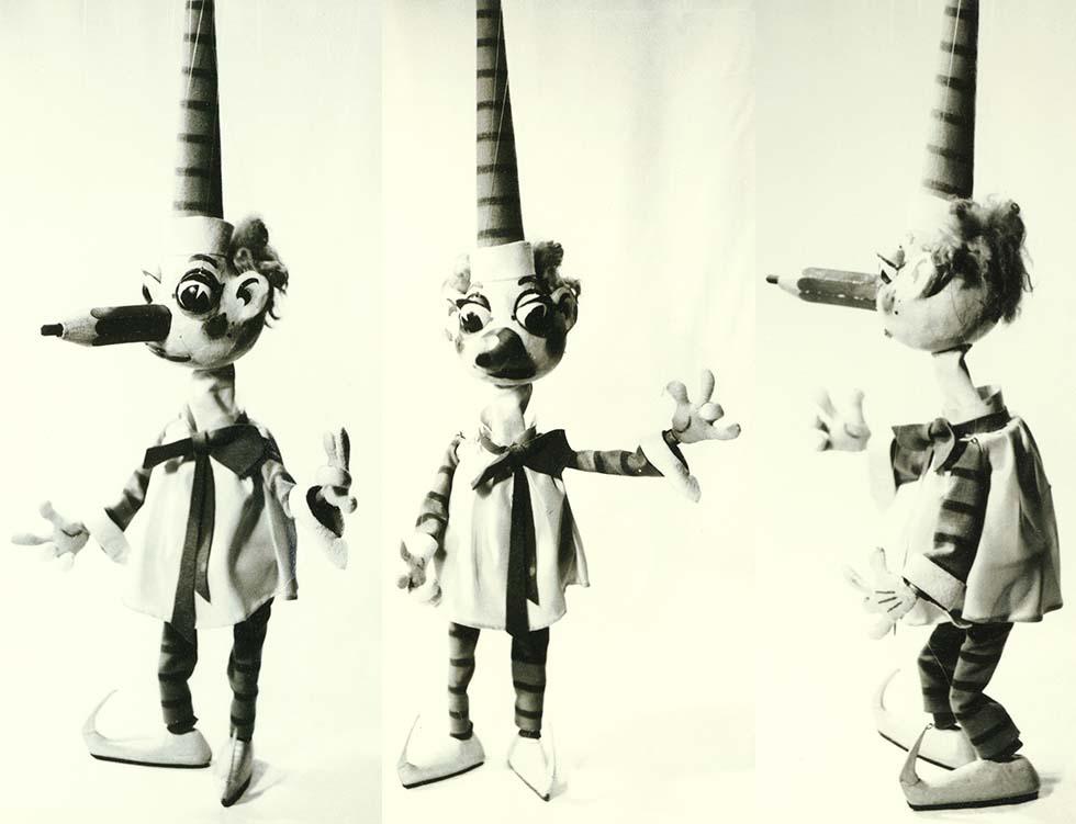 Mr Squiggle shown from three different sides.