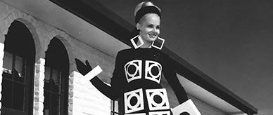 Photograph of a woman wearing an outfit of circles within squares