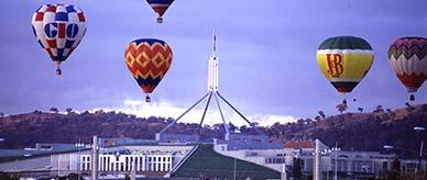 Photograph of balloons flying over Parliament House