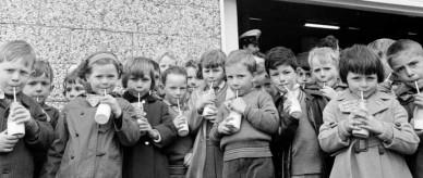 Children drinking milk at the Melbourne milk depot as part of the free school milk program.