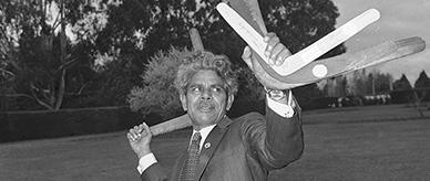 Senator Neville Bonner throwing a boomerang.