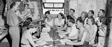 This is a photograph of migrants learning English at the Bathurst Reception Centre, New South Wales.