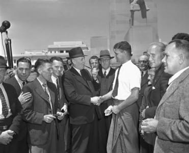 Prime Minister Ben Chifley and Immigration Minister Arthur Calwell greet postwar migrants.