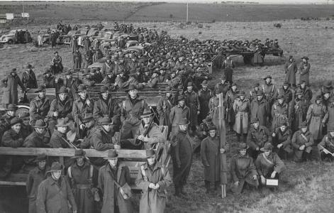 Men of the Volunteer Defence Corps gathered on trucks for a photograph.