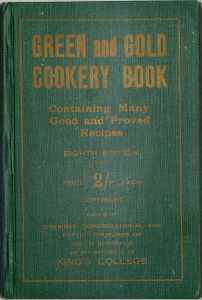 Cookbook cover with gold print and bound with green cloth.